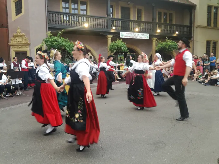 Folklore dancing in the evening at Colmar, Alsace (France)